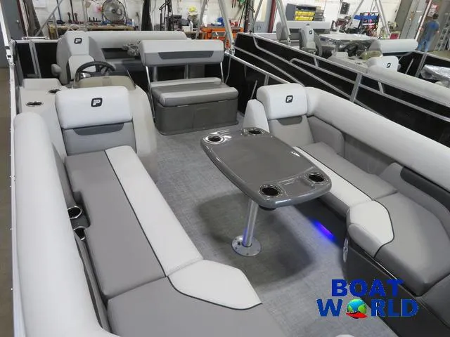 Slide: The Image of 2025 Princecraft Vectra 23 RL pontoon boat interior with seating and table. - 28