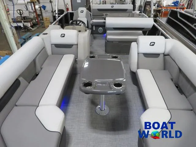 Slide: The Image of 2025 Princecraft Vectra 23 RL pontoon interior with seating and table, showcased at Boat World. - 7