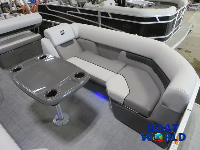 Slide: The Image of 2025 Princecraft Vectra 23 RL pontoon with swingback dinette, gray seating, and table. - 9