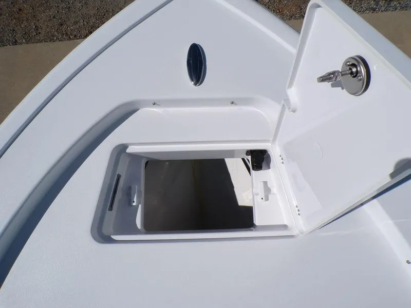 Slide: The Image of 2025 Sportsman Masters 247 boat storage compartment with open hatch and secure lock. - 14