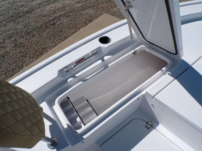 Slide: The Image of 2025 Sportsman Masters 247 boat storage compartment with open lid, showcasing interior space. - 17