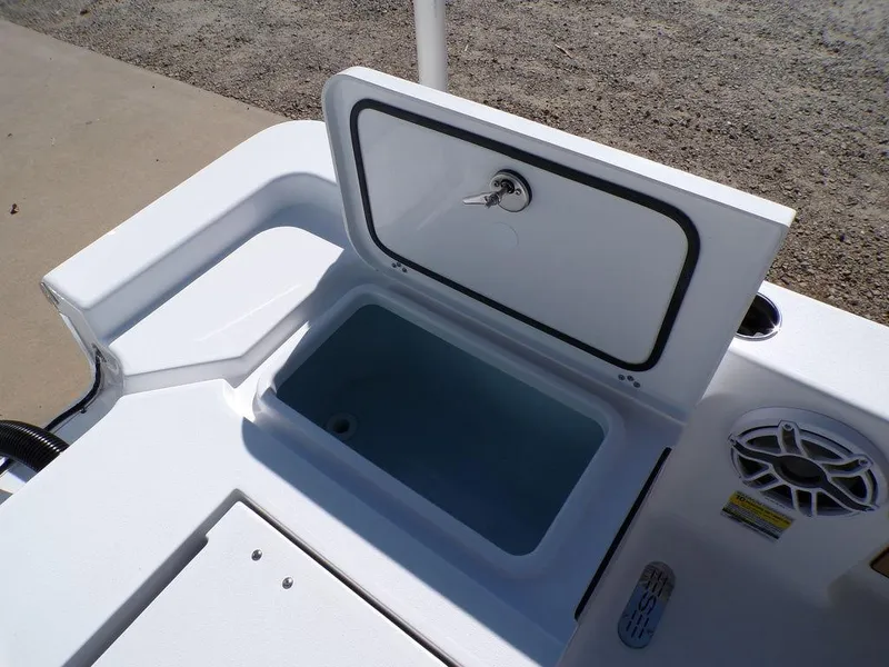 Slide: The Image of Open storage compartment on 2025 Sportsman Masters 247 boat, featuring a secure latch. - 22