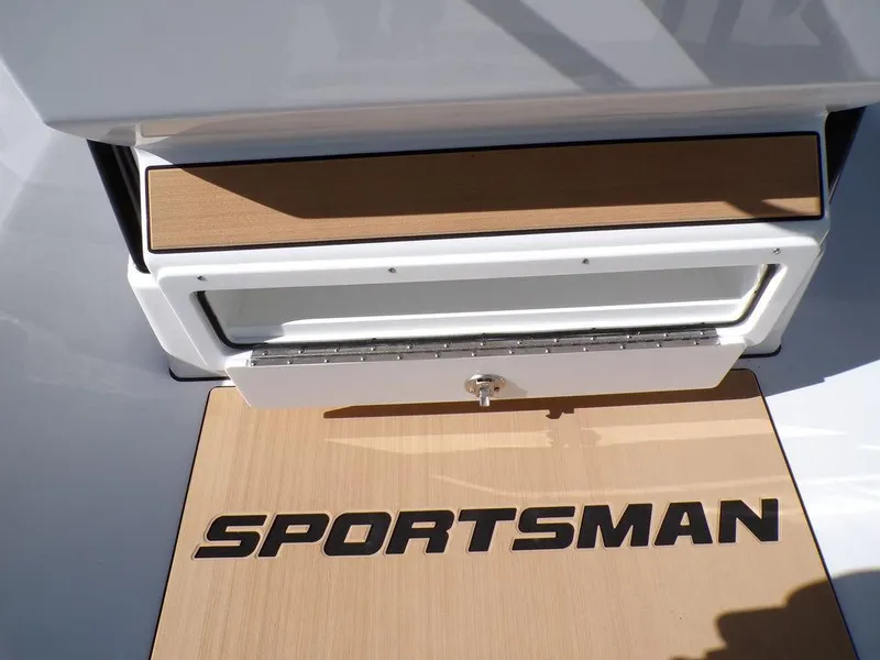 Slide: The Image of 2025 Sportsman Masters 247 boat deck with logo and storage compartment. - 26