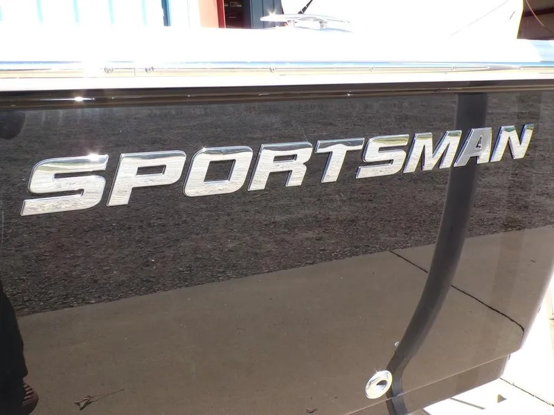 Slide: The Image of 2025 Sportsman Masters 247 boat with sleek black exterior and bold logo. - 7