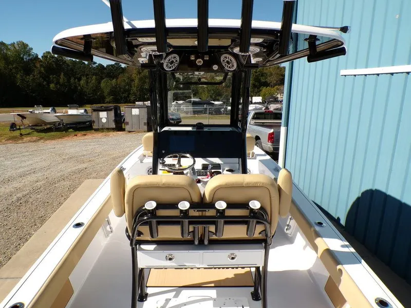 Slide: The Image of 2025 Sportsman Masters 247 boat interior with beige seating and modern dashboard. - 9