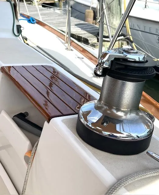 Slide: The Image of Close-up of a 1998 Tartan 4100 sailboat winch and deck details. - 22