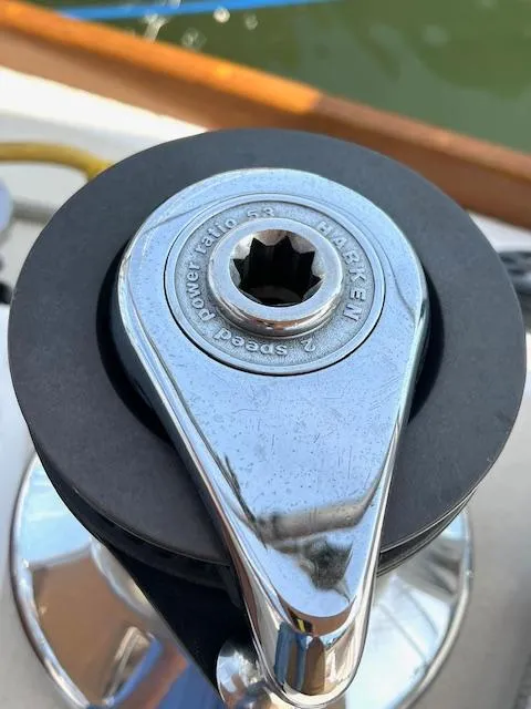 Slide: The Image of Close-up of a 1998 Tartan 4100 sailboat winch, featuring a shiny chrome finish. - 25