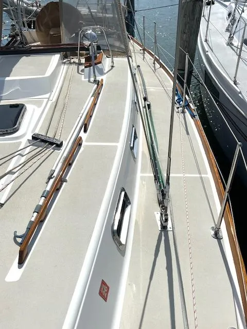 Slide: The Image of 1998 Tartan 4100 sailboat deck with sleek design and polished wood accents. - 30
