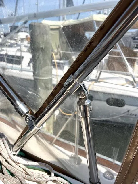 Slide: The Image of Close-up of Tartan 4100 sailboat rigging, 1998 model, with marina background. - 34