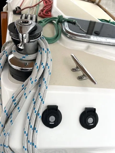 Slide: The Image of Close-up of 1998 Tartan 4100 sailboat deck with winch, cleat, and ropes. - 36