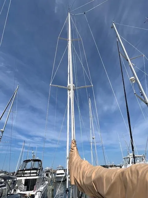 Slide: The Image of Sailboat mast of 1998 Tartan 4100 against a clear blue sky in a marina. - 39
