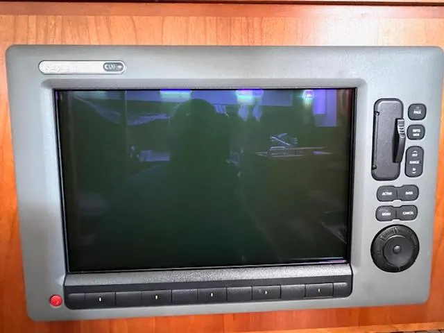 Slide: The Image of Tartan 4100 1998 boat control panel with buttons and screen. - 43