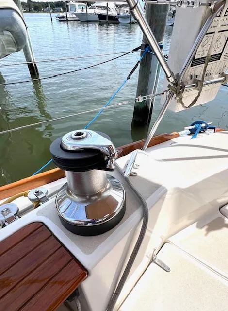 Slide: The Image of 1998 Tartan 4100 sailboat deck with winch, docked at marina. - 6