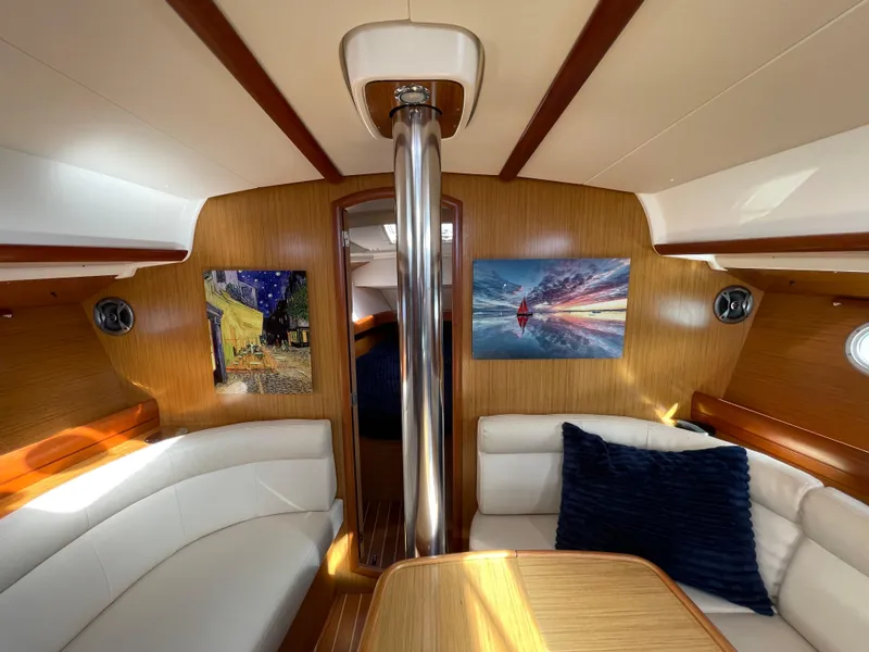 Slide: The Image of Interior of 2008 Jeanneau 39i sailboat with cozy seating and artwork. - 19