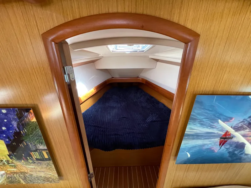 Slide: The Image of Cozy cabin interior of 2008 Jeanneau 39i sailboat with artwork and skylight. - 20