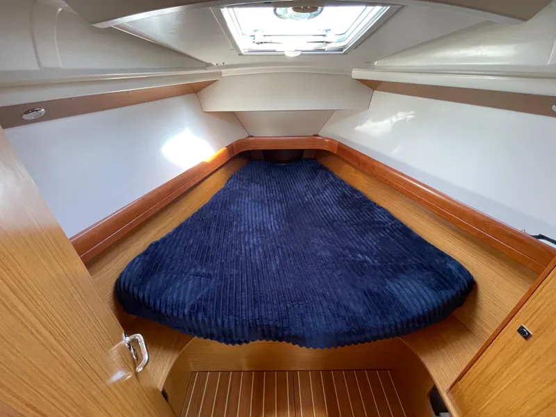 Slide: The Image of 2008 Jeanneau 39i sailboat cabin with cozy bed and skylight. - 21