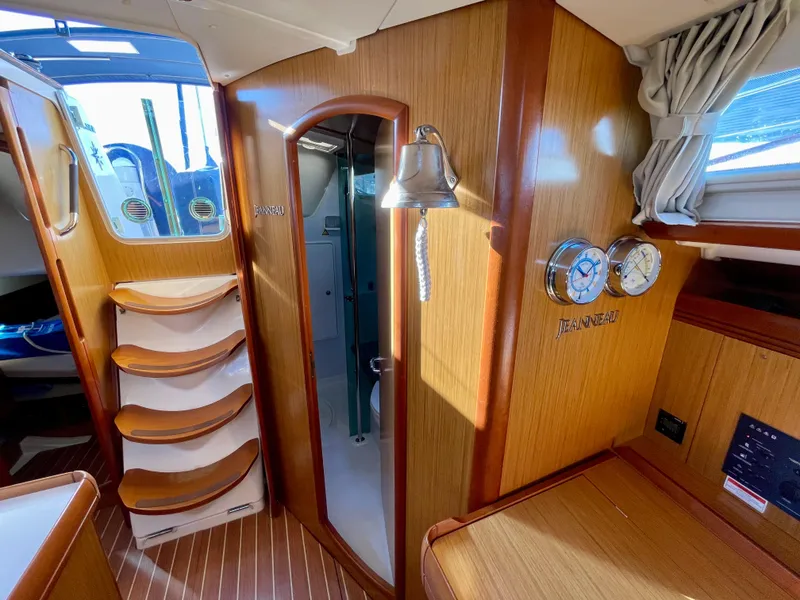 Slide: The Image of Interior of 2008 Jeanneau 39i sailboat with wooden finish and nautical decor. - 25