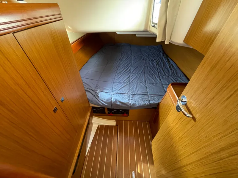 Slide: The Image of 2008 Jeanneau 39i cabin interior with wooden finish and cozy bed. - 30