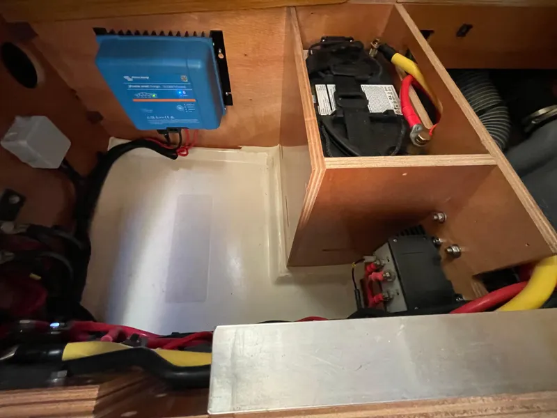 Slide: The Image of Electrical components in a 2008 Jeanneau 39i sailboat, featuring wiring and battery setup. - 33