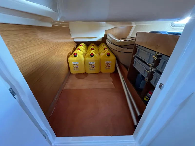 Slide: The Image of Storage area in 2008 Jeanneau 39i sailboat with fuel containers and equipment. - 37