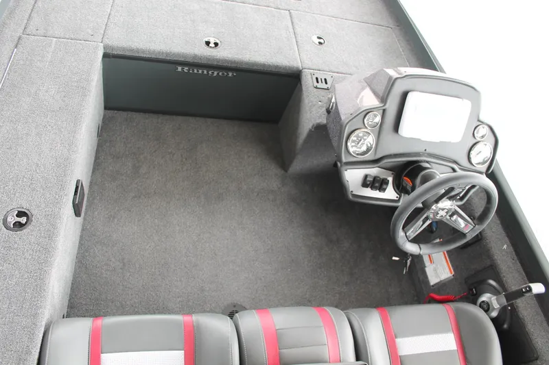 Slide: The Image of 2024 Ranger RT188C boat interior with steering wheel and seating. - 10