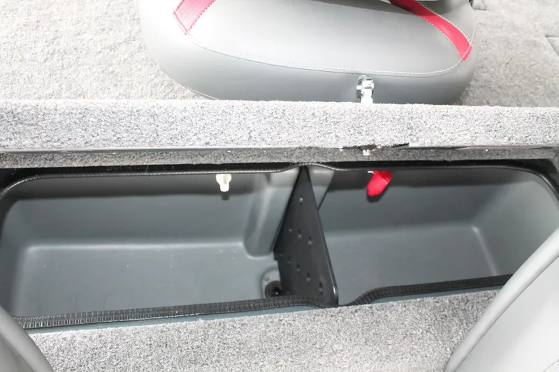 Slide: The Image of 2024 Ranger RT188C boat storage compartment with gray interior and red accents. - 13