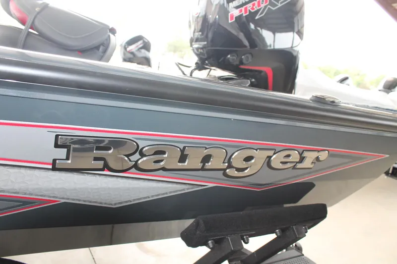 Slide: The Image of 2024 Ranger RT188C boat with sleek design and bold logo. - 15