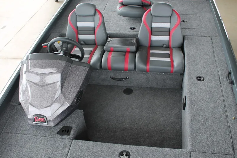 Slide: The Image of 2024 Ranger RT188C boat interior with gray and red seating, steering console. - 19