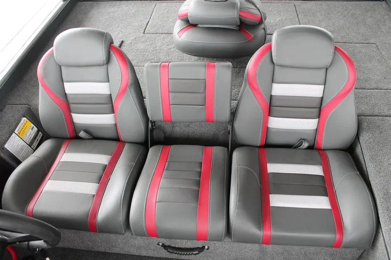Slide: The Image of 2024 Ranger RT188C boat seats with gray, red, and white upholstery. - 21