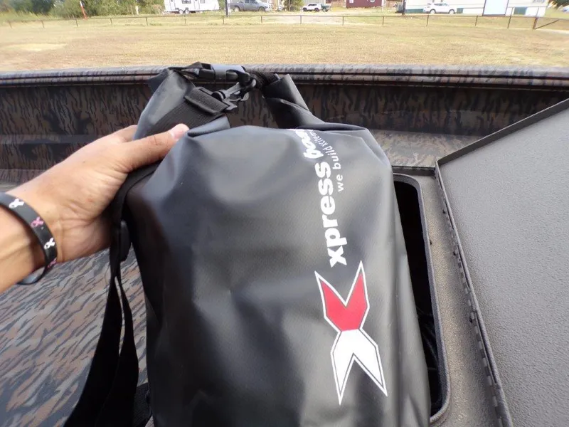 Slide: The Image of Hand holding Xpress branded bag in XTS16 boat, 2025 model. - 6