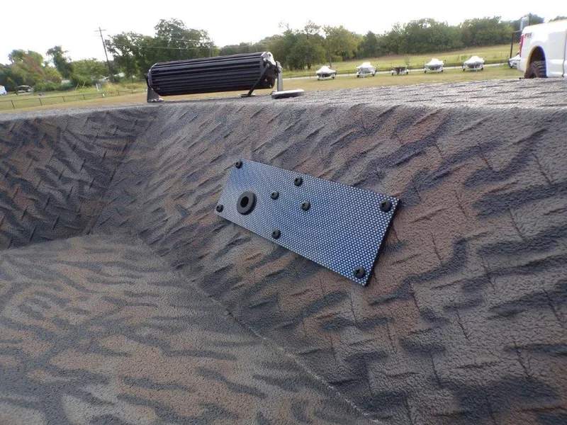 Slide: The Image of 2025 Xpress XTS16 boat interior with textured surface and mounted panel. - 7