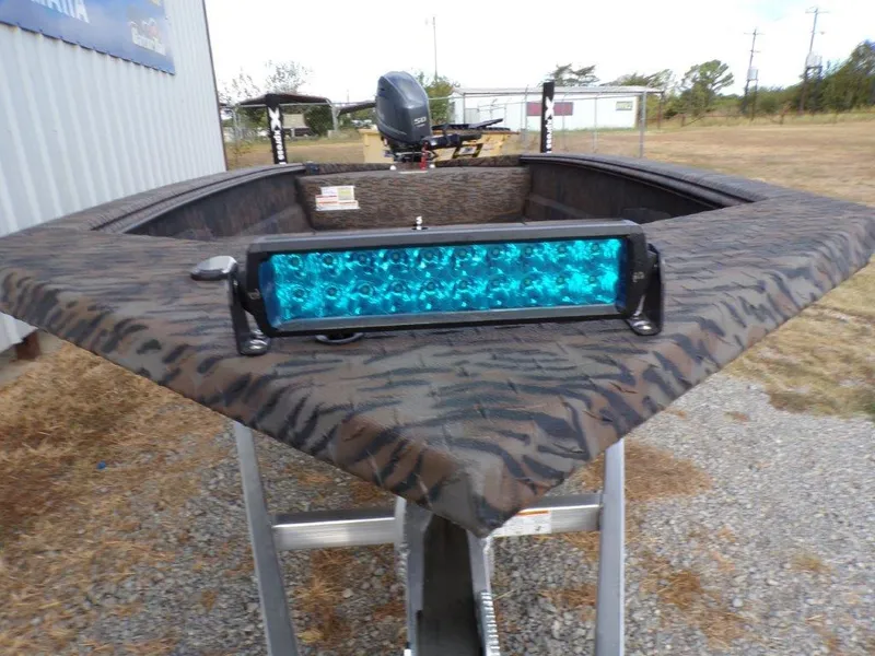 Slide: The Image of 2025 Xpress XTS16 boat with blue LED light bar on the bow. - 8