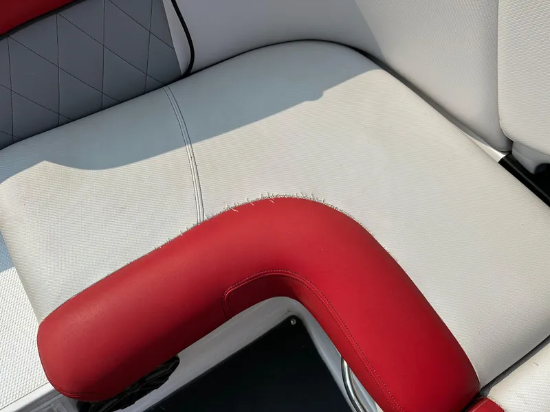 Slide: The Image of Red and white seating in 2012 MasterCraft X45 boat interior. - 10