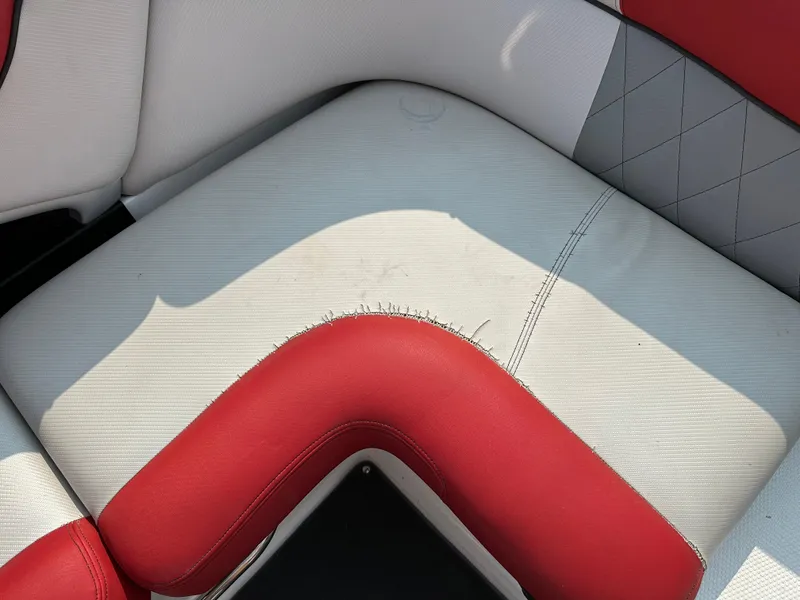 Slide: The Image of Red and white seat upholstery in a 2012 MasterCraft X45 boat. - 11