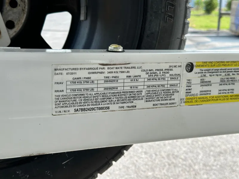 Slide: The Image of Label on 2012 MasterCraft X45 trailer showing tire and loading information. - 13