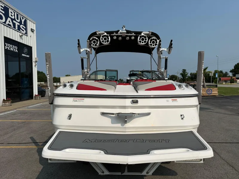 Slide: The Image of 2012 MasterCraft X45 boat with speakers, parked outside a dealership. - 14