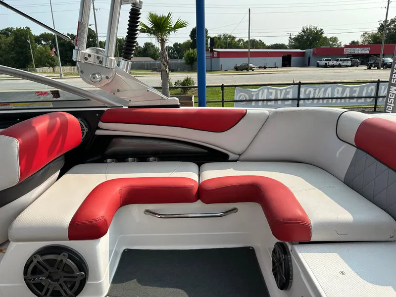 Slide: The Image of 2012 MasterCraft X45 boat interior with red and white seating. - 18