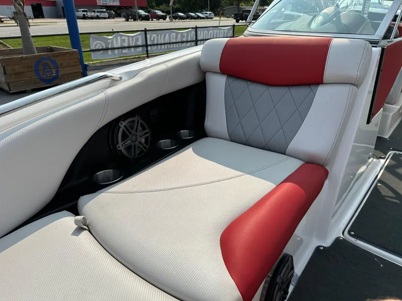 Slide: The Image of 2012 MasterCraft X45 boat interior with red and white seating. - 24
