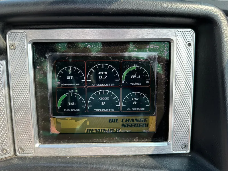 Slide: The Image of Dashboard of 2012 MasterCraft X45 showing gauges and oil change reminder. - 7
