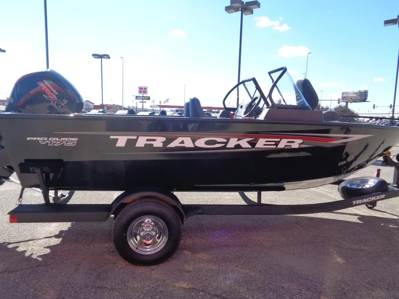 Slide: The Image of 2025 Tracker Pro Guide V-175 WT boat on trailer in parking lot. - 3