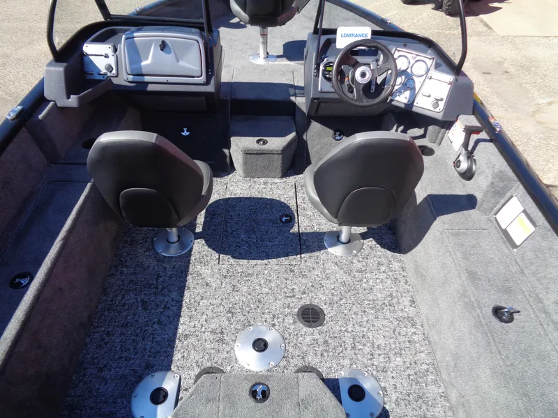 Slide: The Image of 2025 Tracker Pro Guide V-175 WT boat interior with dual seats and steering console. - 6