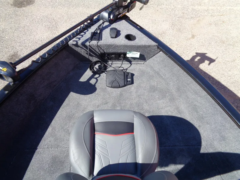 Slide: The Image of 2025 Tracker Pro Guide V-175 WT boat interior with gray seating and fishing equipment. - 7