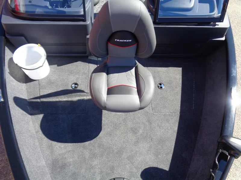 Slide: The Image of 2025 Tracker Pro Guide V-175 WT boat interior with gray seating and carpet. - 9