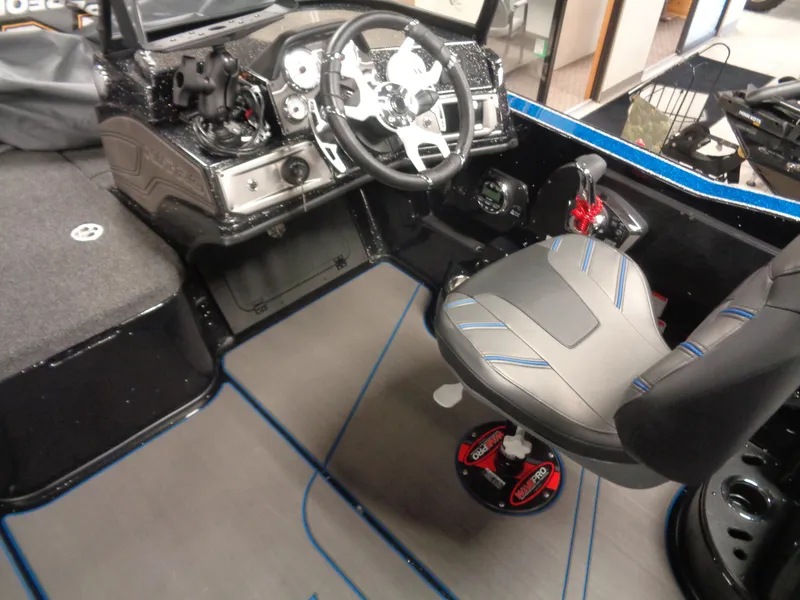 Slide: The Image of 2024 Nitro ZV20 Pro boat interior with steering wheel and seating. - 11
