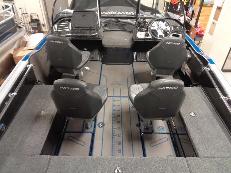 Slide: The Image of 2024 Nitro ZV20 Pro boat interior with four seats and advanced dashboard. - 7