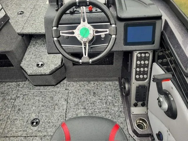 Slide: The Image of 2024 Ranger VX1888 WT boat cockpit with steering wheel and control panel. - 3