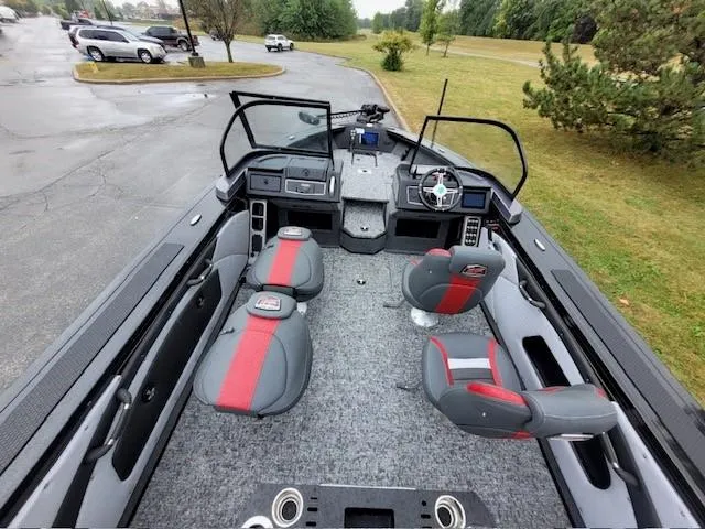 Slide: The Image of 2024 Ranger VX1888 WT boat interior with gray and red seating, steering console, and spacious layout. - 4