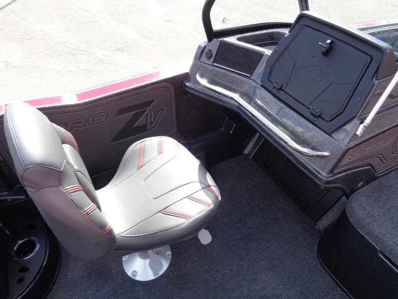 Slide: The Image of 2024 Nitro ZV20 Pro boat interior with gray seat and storage compartment. - 11