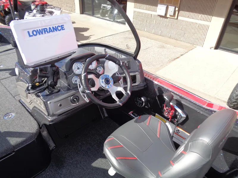 Slide: The Image of 2024 Nitro ZV20 Pro boat cockpit with Lowrance navigation system and modern steering wheel. - 12