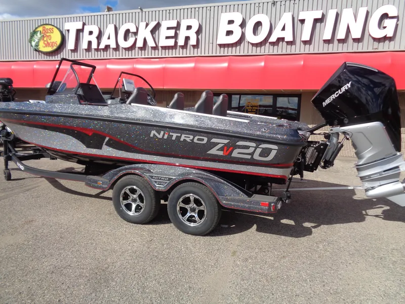 Slide: The Image of 2024 Nitro ZV20 Pro boat at Tracker Boating store, featuring sleek design and Mercury engine. - 2